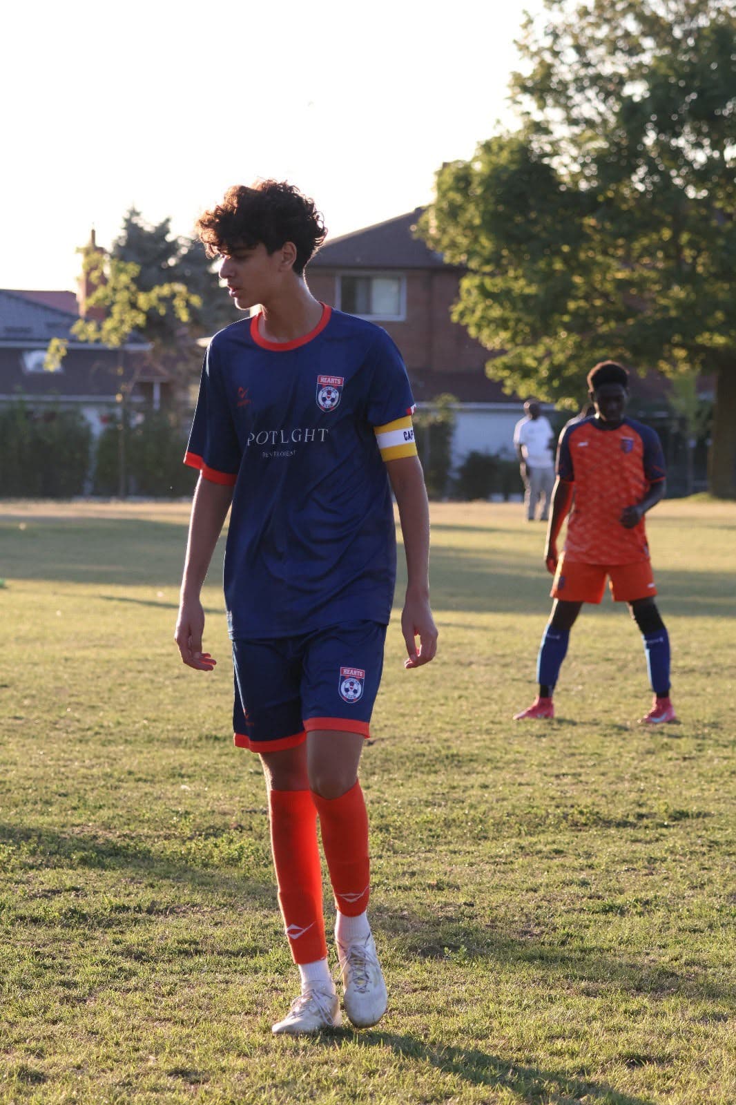 Radin Hajipour, young football captain in Toronto, wearing the captain's armband